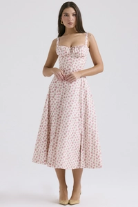 Detailed front view of white floral camisole midi dress with pink flower patterns