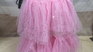 Detail of pink tutu skirt with silver star and moon sequins on multi-layered mesh