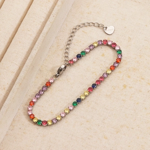 Detailed close-up of rainbow zircon tennis bracelet with heart charm and lobster clasp