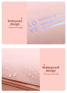 Detail of pink PU leather makeup bag showing waterproof surface and embossed love design