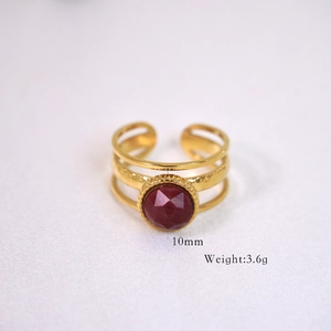 Detail of 14k gold plated layered ring with a 10mm red gemstone and 3.6g weight info
