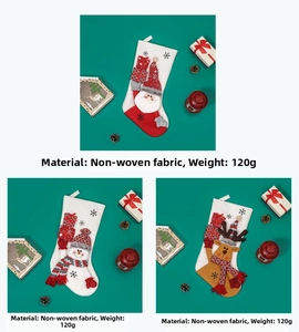 Detailed view of non-woven Christmas stockings with 3D Santa, Snowman and Reindeer designs