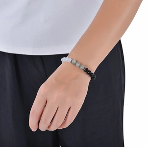 Elastic 8mm moonstone and obsidian beaded bracelet shown on a model wrist for women