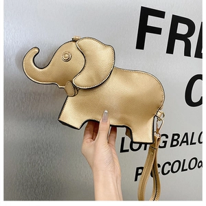 Close-up of golden elephant-shaped PU leather clutch bag with a matching wrist strap