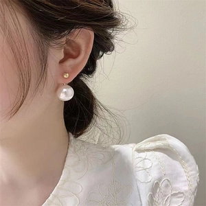Elegant S925 silver needle pearl earrings featuring a large white pearl and golden bead
