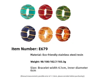 Close-up of colorful resin and stainless steel bangles with textured patterns