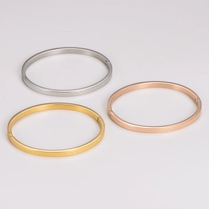 Classic maze pattern bangle set in gold, silver and rose gold with polished finish