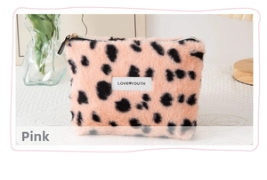 Close-up of pink leopard print plush makeup bag with Love Youth label and zipper detail