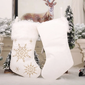 White Christmas stocking with gold snowflake embroidery and faux fur trim for holiday decor