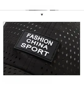 Detail of black breathable mesh fabric with fashion sport rubber patch on baseball cap