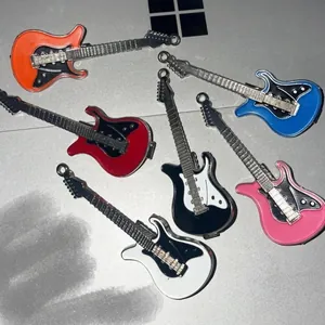 Y2K alloy guitar hair clips in multiple colors on a metallic surface