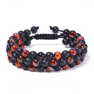 Detail of double-layer woven bead bracelet with matte black and polished brown stones