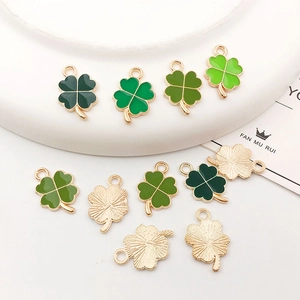 Set of 10 green enamel four-leaf clover charms in gold alloy for DIY jewelry making