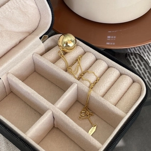 Close-up of 925 sterling silver ball necklace inside a travel jewelry organizer box