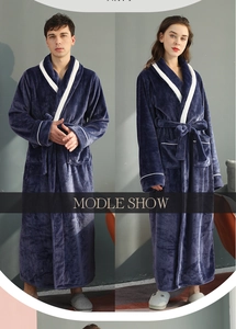 Detail of navy blue flannel bathrobe with contrast lapel and soft plush texture