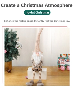 Detail of Christmas gnome with long striped legs, knit hat and HO HO HO label decoration