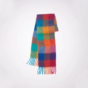 Detail of colorful plaid mohair scarf featuring chunky braided fringe and thick texture