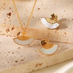 Elegant gold fan-shaped necklace and earrings set with white shell inlay on stone