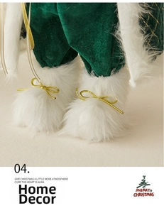 Close-up of Santa doll with green velvet legs, white faux fur trim, and golden bows