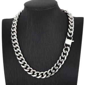 Detail of silver stainless steel Cuban link necklace with large spring clasp on neck model