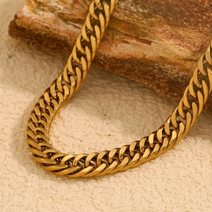 Macro detail of 18K gold plated thick Cuban chain necklace with secure OT toggle clasp