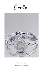 Detail of silver camellia-shaped watch face with full diamond inlay on mirror surface