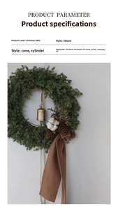 Detail of Christmas wreath with vintage gold bell, pine cones and decorative cotton flower