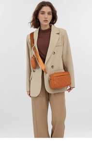 Brown quilted crossbody bag detail with matching coin purse and stylish wide strap