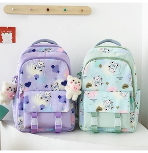 Detail of dreamlike gradient school bags with cute bear prints and plush pendants