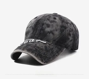Detailed view of washed grey cotton baseball cap with white script Luzzz embroidery