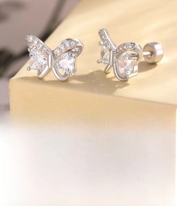 Macro shot of silver zircon butterfly stud earrings with dimensions and steel back detail