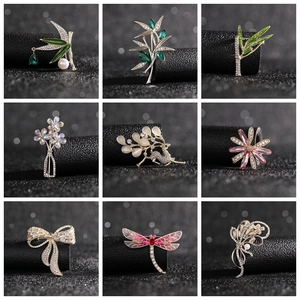 Collage showing various elegant deer, bamboo leaf, and dragonfly brooches with pearls