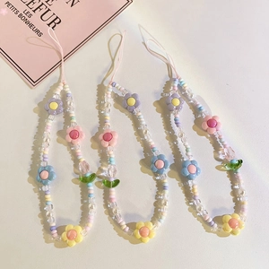 Detailed view of three colorful tulip beaded phone straps made of acrylic and resin