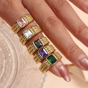 Detail of 18K gold plated scale textured rings with colorful rectangular cubic zirconia