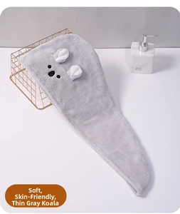 Detail of soft grey coral fleece hair towel featuring a cartoon koala face with 3D ears