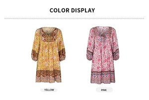 Vue détaillée de robes d'été bohèmes à col en V en motifs jaunes et roses