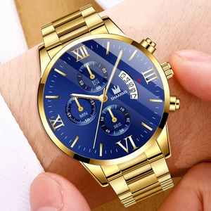 Macro detail of men's gold stainless steel watch with blue sunray Roman dial