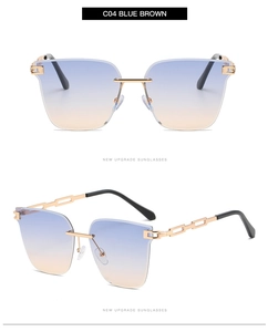 Close-up of rimless sunglasses with blue-brown gradient lenses and gold chain metal temples