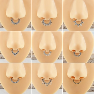 Macro display of assorted marquise zircon septum rings in silver and gold finishes