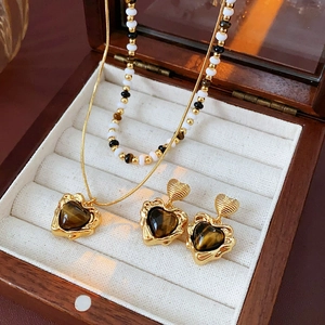 Tiger eye heart necklace and earrings set displayed in a premium wooden jewelry box