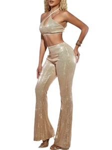 Golden sequin two-piece set featuring halter top and high-waist flared pants on model