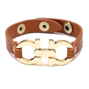 Close-up of brown PU leather bracelet featuring a gold Gancini style metal horse-bit clasp