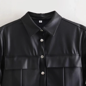 Women's black PU leather shirt jacket with silver snap buttons and front chest pockets