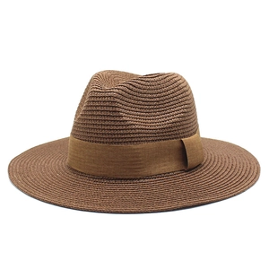Classic dark brown Panama straw hat with wide brim and fedora crown for summer sun protection