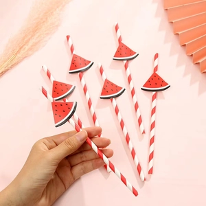 Biodegradable red and white striped paper straws with watermelon slices for party decor