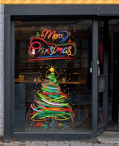 Detailed view of colorful Christmas tree window stickers with Merry Christmas lettering