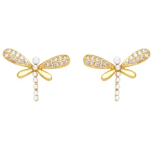 Elegant gold dragonfly stud earrings featuring sparkling crystals and white pearls