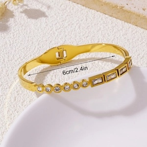 Modern gold titanium steel bangle with round and square cubic zirconia, 6cm inner diameter