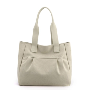 Minimalist beige canvas tote bag with pleated front pocket and reinforced handles