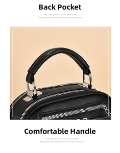 Close-up of black lychee grain leather handbag with comfortable handle and silver zipper